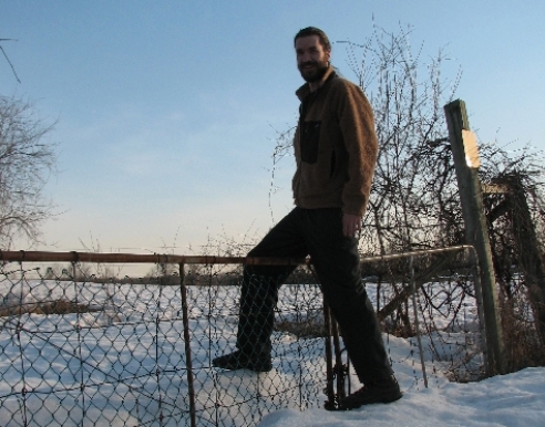April 16 - MBO volunteer Brian Bell crosses over the front fence at MBO. This is the first time since MBO was launched in 2004 that we have had snow this late into spring, let alone this much of it. (Photo by Barbara Frei).